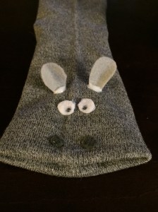 Glue the eyes on top near the ears. Take your black marker and draw a dot on each one.